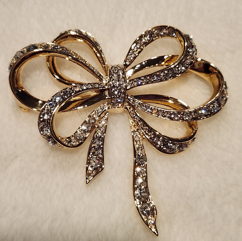 K.J.L. for Avon Rhinestone Gold Tone Bow Brooch